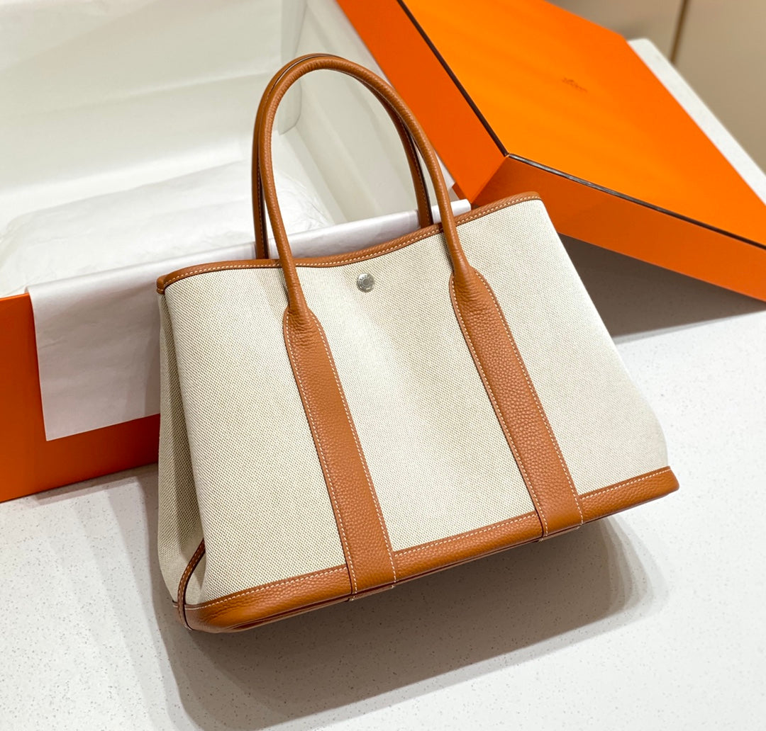 HERMES GARDEN PARTY 36CM IN WHITE TOILETS COTTON CANVAS AND BROWN CALFSKIN
