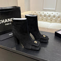 Chanel Black Ankle Boots with Gold-Tone Logo Detail