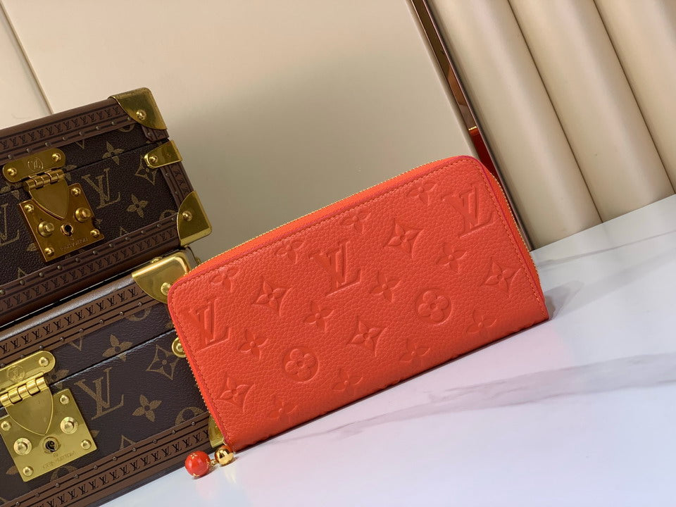 Orange Monogram Embossed Zip-Around Wallet